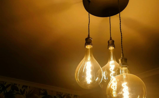 Wrought iron industrial chandelier with hanging globes