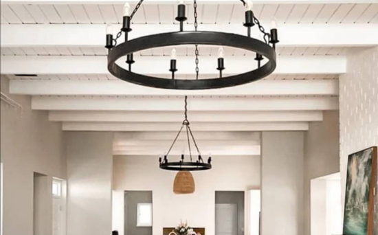 Two black wrought iron wagon wheel chandeliers