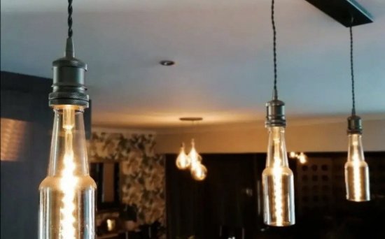 Wrought Iron linear chandelier hanging from ceiling